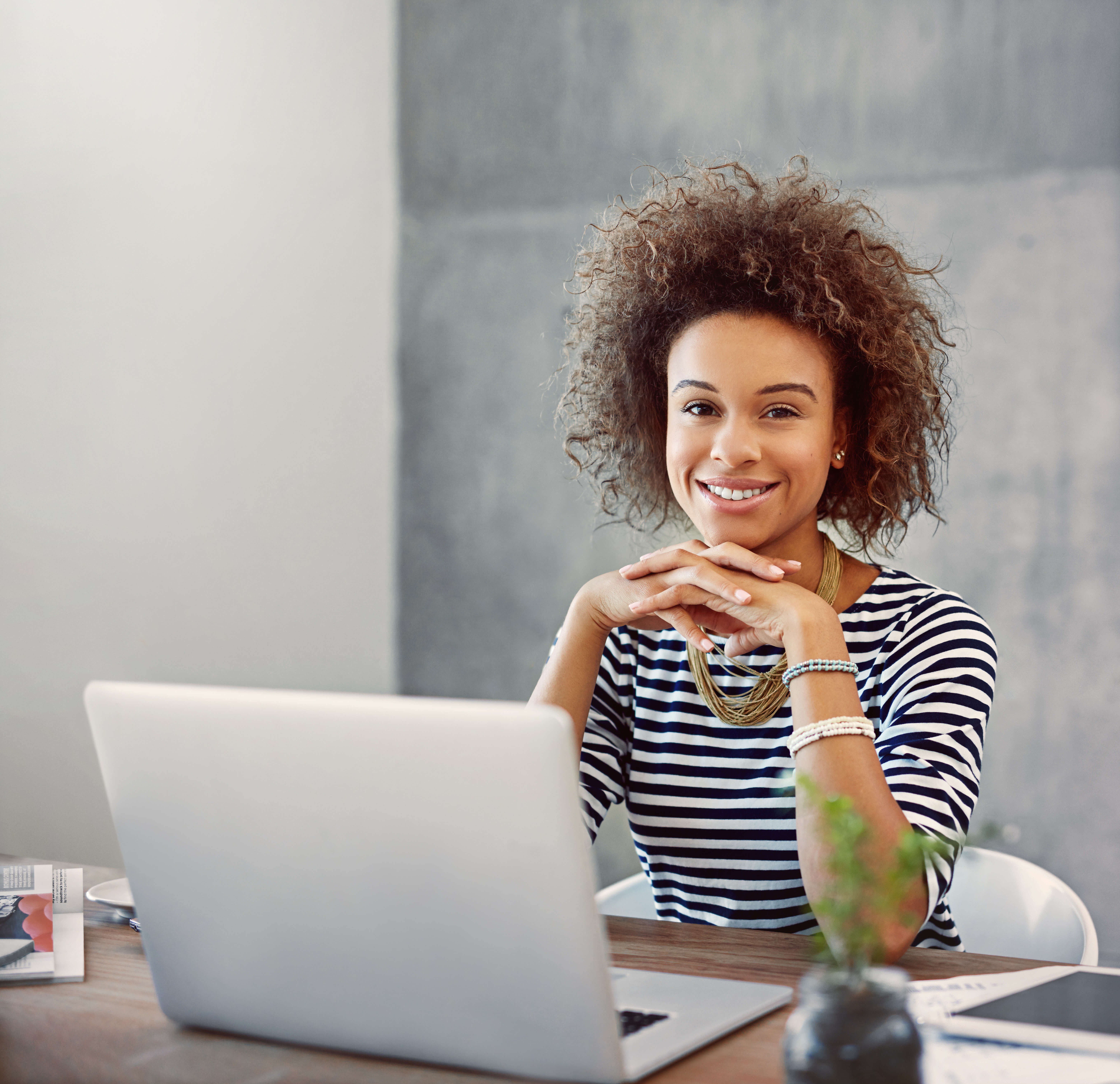 Woman Smiling On Laptop